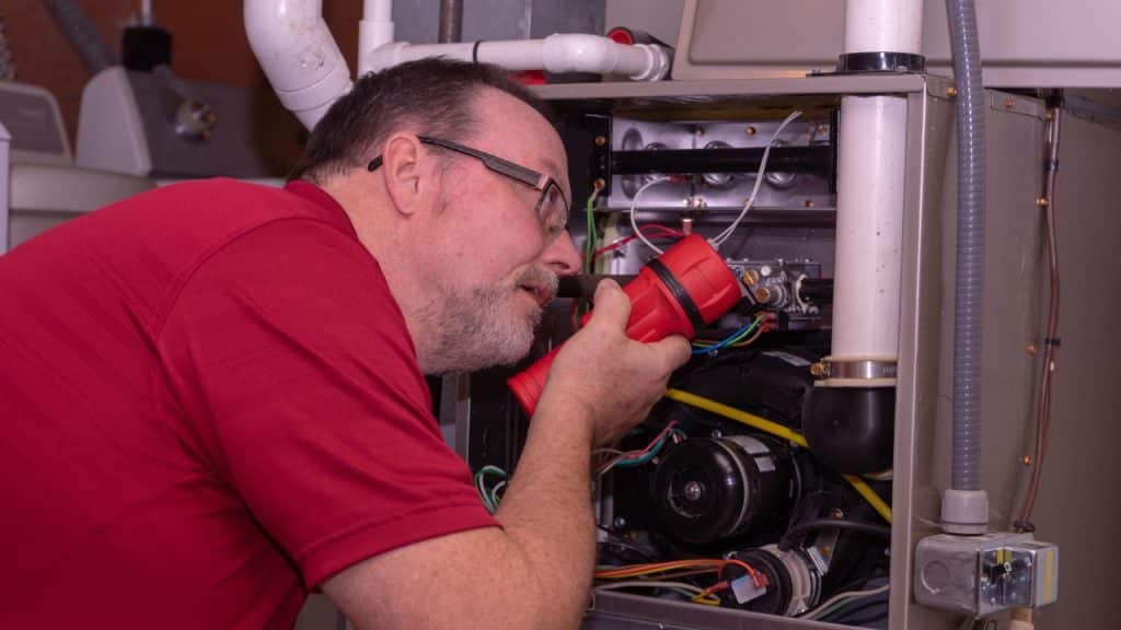 Getting Organized After Winter: 20 Essential Tasks 4 Inspecting Furnace Photo Credit IndyEdge via Depositphotos