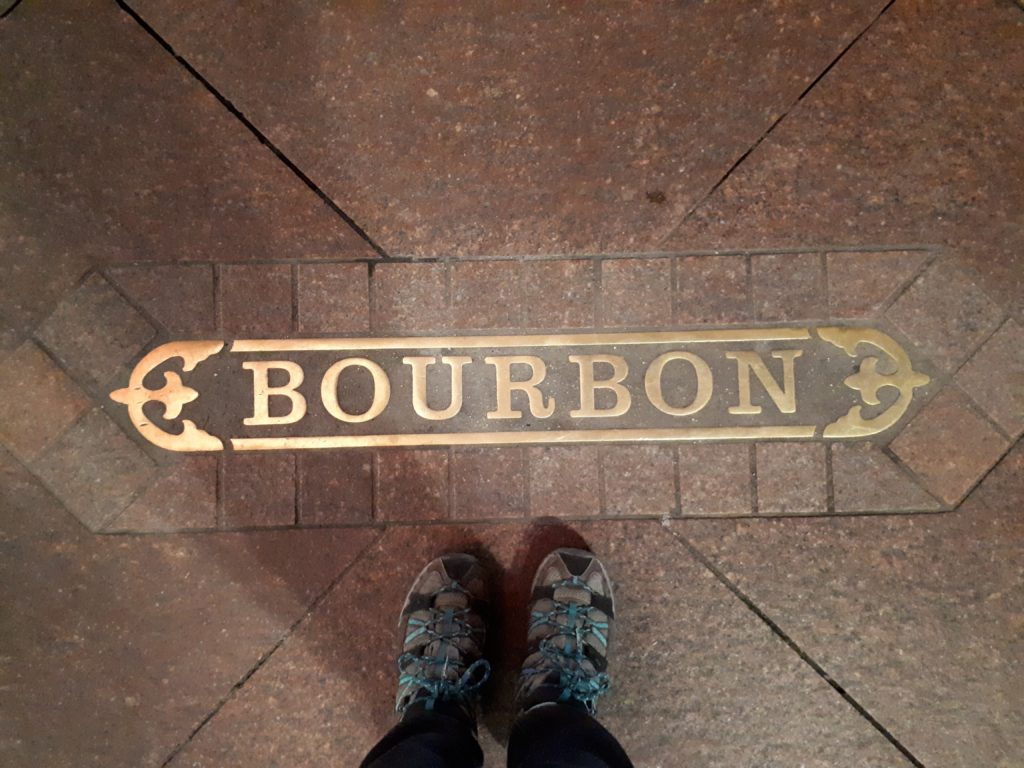 Signature Cocktails & Good Eats in New Orleans #onetimeinNOLA 23 Bourbon Street sign on the sidewalk in New Orleans