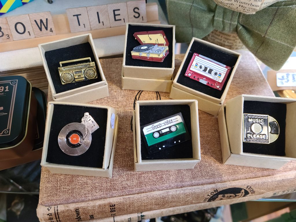 Variety of pins in Bird and Bee Vintage in Wincey Mills Co. Market in Downtown Paris Ontario