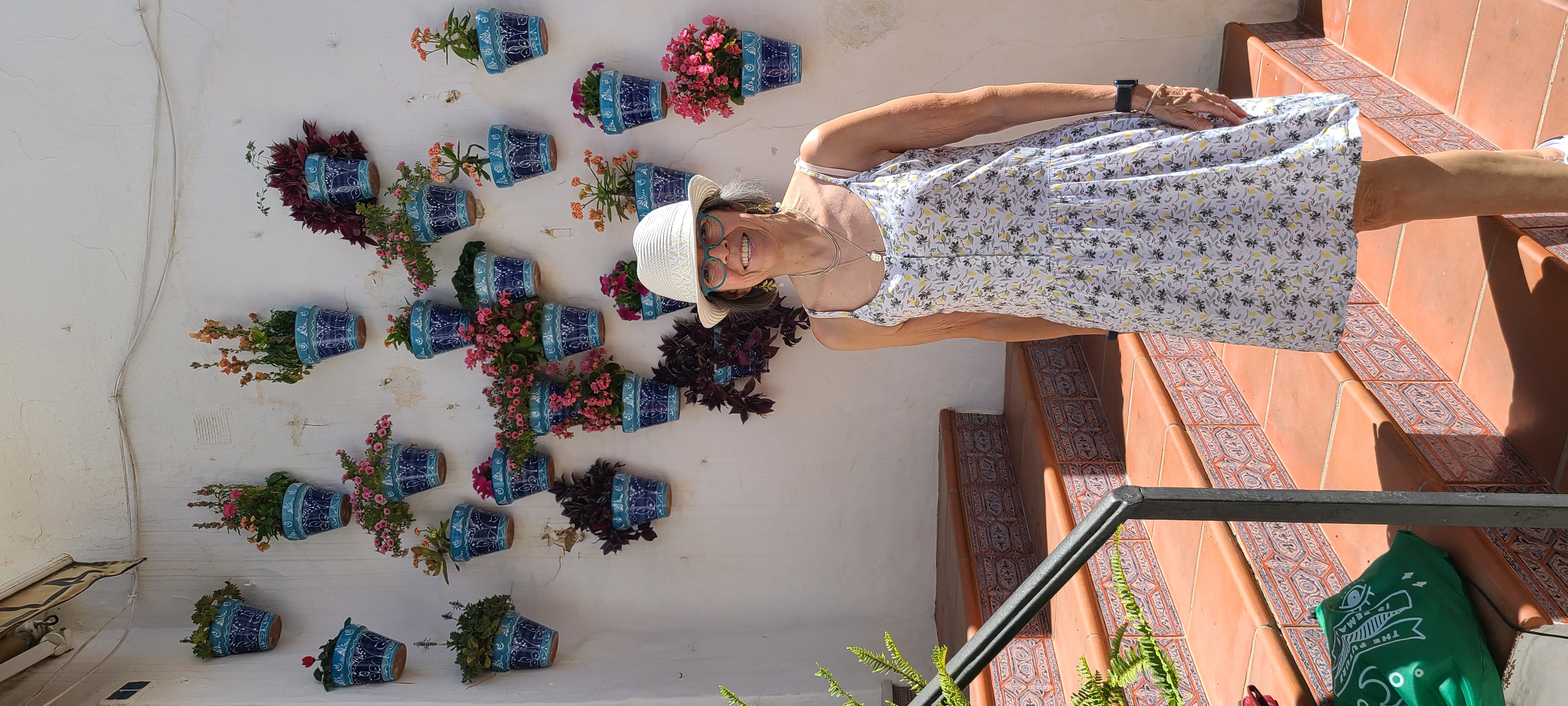 Quaint Pueblos Blancos in Southern Spain - Visiting Mijas 13 You can often find blue pots filled with flowers when you are visiting Mijas, Spain.