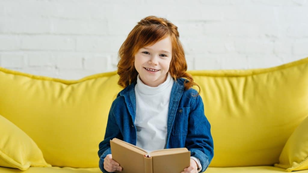 15 Great Ideas on How to Plan a Stress-Free Family Vacation 5 Child Reading Photo credit IgorVetushko via Depositphotos