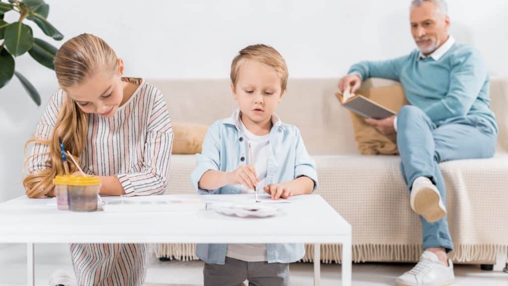 15 Great Ideas on How to Plan a Stress-Free Family Vacation 12 Granddad with children Photo Credit EdZbarzhyvetsky via Depositphoto