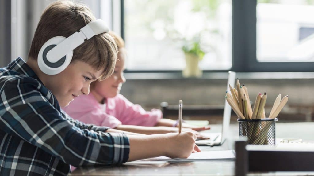 15 Great Ideas on How to Plan a Stress-Free Family Vacation 4 Kids on computers Photo Credit Y Boychenko via Depositphoto