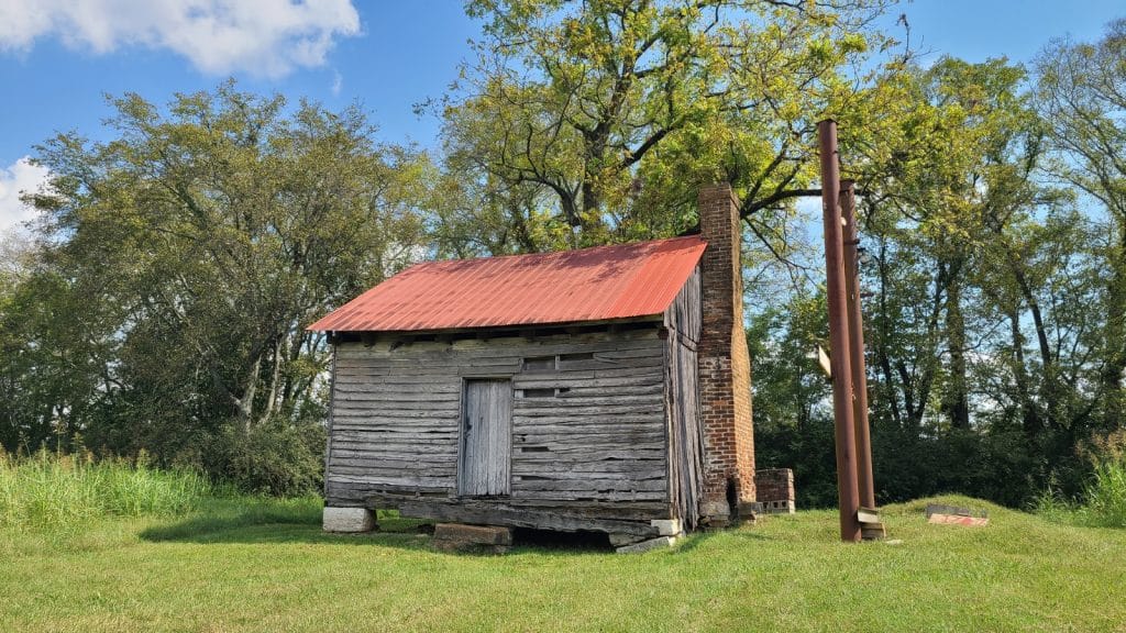 Battle of Franklin - Three Historic Sites Not to Miss in Franklin, TN 5 Slave House, Rippa Villa, Spring Hill, TN Photo Credit_ Margarita Ibbott via DownshiftingPRO Small wooden house with a large brick chimney on the grounds of Rippa Villa