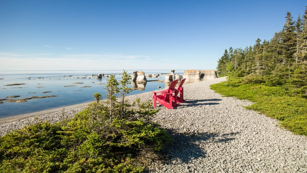 London's Come From Away: Red Chairs & Real Stories - Book Before May 31 Sellout 3 Parks Canada red chairs offering a view of limestone monoliths at Anse des Erosions on Ile Quarry. Mingan Archipelago National Park Reserve Photo Credit Eric Lajeunesse via Parks Canada